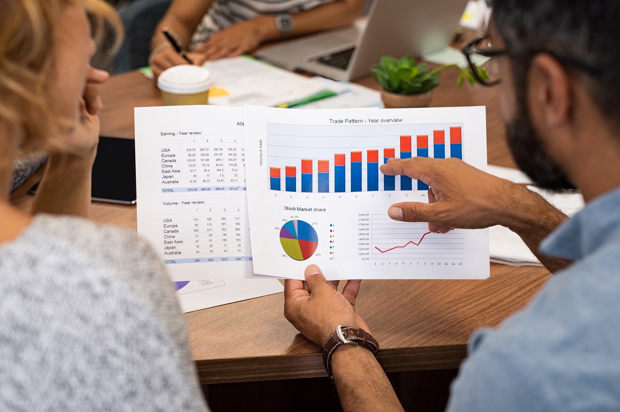 man looking at graphs for virtual numbers page by Claritel, business telecoms experts